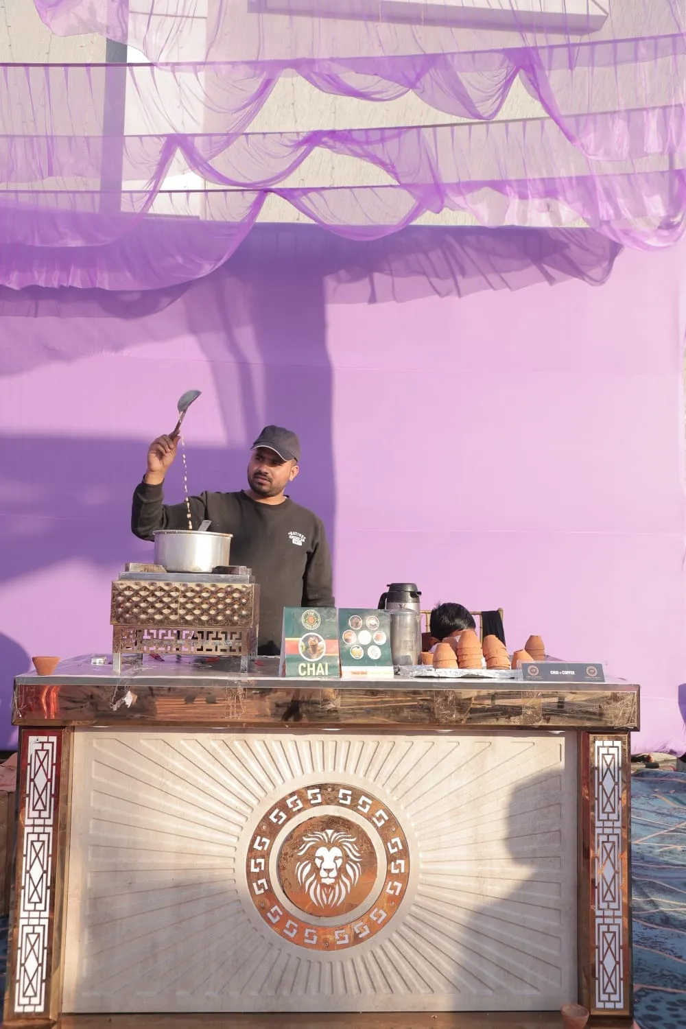 Hand-painted wooden counter under violet drapes